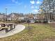 Community area with picnic tables, grill, pool and fenced in area at 5825 Catalina Dr. # 124, North Myrtle Beach, SC 29582