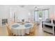 Open floorplan living space with natural light, comfortable seating, and an archway to the kitchen at 5825 Catalina Dr. # 124, North Myrtle Beach, SC 29582