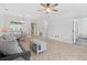 Open-concept living room features a view of the dining area and kitchen with modern tile flooring and neutral paint at 5825 Catalina Dr. # 124, North Myrtle Beach, SC 29582