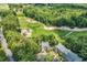 Aerial view of property near a beautiful green golf course, surrounded by lush green trees at 598 Blue Stem Dr. # 52E, Pawleys Island, SC 29585