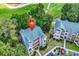 Aerial view of the condos near a golf course with a location marker on top of the building at 598 Blue Stem Dr. # 52E, Pawleys Island, SC 29585