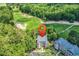 Aerial view of the condos near the golf course marked by a location pin, nestled in trees at 598 Blue Stem Dr. # 52E, Pawleys Island, SC 29585