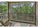 Relax on the private balcony with scenic views of the surrounding trees at 598 Blue Stem Dr. # 52E, Pawleys Island, SC 29585