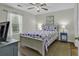 Comfortable bedroom featuring a nautical-themed bedspread, a ceiling fan, and a sunny window at 598 Blue Stem Dr. # 52E, Pawleys Island, SC 29585