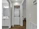 Hallway with stackable washer and dryer adjacent to a bathroom and bedroom at 598 Blue Stem Dr. # 52E, Pawleys Island, SC 29585