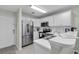 Bright white kitchen with stainless steel appliances and white countertops at 598 Blue Stem Dr. # 52E, Pawleys Island, SC 29585