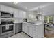 Bright white kitchen with stainless steel appliances and white countertops at 598 Blue Stem Dr. # 52E, Pawleys Island, SC 29585