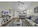 Open living room, adjacent to kitchen, with ceiling fan and comfortable seating at 598 Blue Stem Dr. # 52E, Pawleys Island, SC 29585