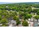 Aerial view displays the property amid mature trees with the ocean visible in the distance at 6001 - 1737 S Kings Hwy., Myrtle Beach, SC 29575