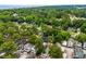 Aerial view displays the property amid mature trees with the ocean visible in the distance at 6001 - 1737 S Kings Hwy., Myrtle Beach, SC 29575