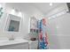 Well-lit bathroom featuring a vanity, mirror, and bathtub with shower at 6001 - 1737 S Kings Hwy., Myrtle Beach, SC 29575