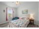 Cozy bedroom with beach-themed decor, chair and natural light at 6001 - 1737 S Kings Hwy., Myrtle Beach, SC 29575