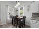 Charming dining area with seating for four and bright windows at 6001 - 1737 S Kings Hwy., Myrtle Beach, SC 29575
