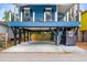 View of the raised house's car port with swing below the main level and outdoor shower at 6001 - 1737 S Kings Hwy., Myrtle Beach, SC 29575