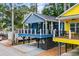 Charming raised beach house featuring a large front porch and covered parking at 6001 - 1737 S Kings Hwy., Myrtle Beach, SC 29575