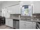 Stylish kitchen featuring white cabinetry and granite countertops at 6001 - 1737 S Kings Hwy., Myrtle Beach, SC 29575