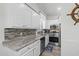 Modern kitchen with granite countertops and stainless steel appliances at 6001 - 1737 S Kings Hwy., Myrtle Beach, SC 29575