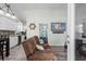 Cozy living room with beach decor, a boat wheel accent, and a view into the modern kitchen at 6001 - 1737 S Kings Hwy., Myrtle Beach, SC 29575