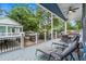 Relaxing porch view with ample seating, ceiling fan, and a view of the surrounding neighborhood at 6001 - 1737 S Kings Hwy., Myrtle Beach, SC 29575
