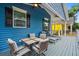 Picture of a spacious porch with seating, a ceiling fan, and view of a yellow house at 6001 - 1737 S Kings Hwy., Myrtle Beach, SC 29575