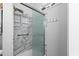 Walk-in shower featuring marble tile surround, glass doors, and a hand-held shower head at 6001 - 1737 S Kings Hwy., Myrtle Beach, SC 29575