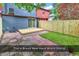 Newly sided townhouse with a private backyard featuring a deck, brick patio, and fresh sod at 633 Sparrow Dr. # B, Surfside Beach, SC 29575