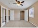 A spacious bedroom offers plush carpeting, a ceiling fan, a window, and closet access to maximize storage at 633 Sparrow Dr. # B, Surfside Beach, SC 29575