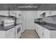 Updated kitchen with sleek white cabinetry, granite countertops, and stainless steel appliances at 633 Sparrow Dr. # B, Surfside Beach, SC 29575