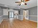 Spacious living room featuring hardwood floors, open to a kitchen with backyard access at 633 Sparrow Dr. # B, Surfside Beach, SC 29575