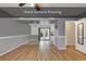 Open-concept living space with hard surface flooring, providing a modern and low-maintenance living area at 633 Sparrow Dr. # B, Surfside Beach, SC 29575
