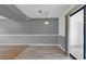 Finished living room space offers modern gray walls, unique lighting, and a sliding door to the outside porch area at 633 Sparrow Dr. # B, Surfside Beach, SC 29575