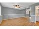 Finished living room space offers sleek wood flooring, neutral gray walls, and a ceiling fan for added comfort at 633 Sparrow Dr. # B, Surfside Beach, SC 29575