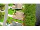 An elevated view showing the layout of this home, its landscaping, and the location of a nearby pond at 6420 Longwood Dr., Murrells Inlet, SC 29576