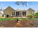 Backyard shows a patio, a fenced in area, landscaping and a screened in porch at 6420 Longwood Dr., Murrells Inlet, SC 29576