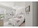 Bright bedroom featuring a large bed with decorative pillows and a quaint vanity area at 6420 Longwood Dr., Murrells Inlet, SC 29576