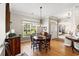 Cozy dining area with natural light, wood flooring, and traditional furnishings at 6420 Longwood Dr., Murrells Inlet, SC 29576