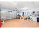 Spacious garage with an automatic door, storage shelves, and ample room for vehicles at 6420 Longwood Dr., Murrells Inlet, SC 29576
