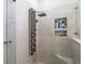 Walk-in shower featuring sleek fixtures and a built-in marble shelf for toiletries at 6420 Longwood Dr., Murrells Inlet, SC 29576