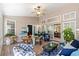 Relaxing sunroom featuring a glass top table and comfortable seating arrangements at 6420 Longwood Dr., Murrells Inlet, SC 29576