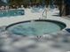 Inviting in-ground hot tub offers a relaxing spot with lounge chairs and nearby pool enhancing outdoor enjoyment at 6805 Creekwatch Rd. # 105, Myrtle Beach, SC 29588