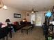 Comfortable living room featuring a ceiling fan and sliding glass doors to the backyard at 6805 Creekwatch Rd. # 105, Myrtle Beach, SC 29588