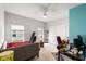 Bedroom featuring two windows, a ceiling fan, a closet, and a desk at 720 Little Fawn Way, Myrtle Beach, SC 29579