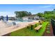 Relaxing community pool area with lounge chairs, picnic benches, and BBQ grills at 720 Little Fawn Way, Myrtle Beach, SC 29579