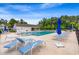 Well-maintained community pool with many lounge chairs and umbrellas at 720 Little Fawn Way, Myrtle Beach, SC 29579