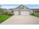 Charming home with a two-car garage, stone accents, and well-manicured lawn at 720 Little Fawn Way, Myrtle Beach, SC 29579