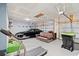 Spacious garage with ample storage, two garage doors, a car, and a treadmill at 720 Little Fawn Way, Myrtle Beach, SC 29579