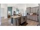 Spacious kitchen with an open layout, granite counters, stainless steel appliances, and a view of the living area at 720 Little Fawn Way, Myrtle Beach, SC 29579