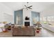 Bright living room with a fireplace, vaulted ceilings, and multiple windows for natural light at 720 Little Fawn Way, Myrtle Beach, SC 29579