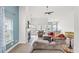 Cozy living room featuring a fireplace, plush seating, and sun-filled windows at 720 Little Fawn Way, Myrtle Beach, SC 29579