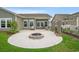 Backyard circular patio features a fire pit and seating area, perfect for outdoor entertaining at 720 Little Fawn Way, Myrtle Beach, SC 29579